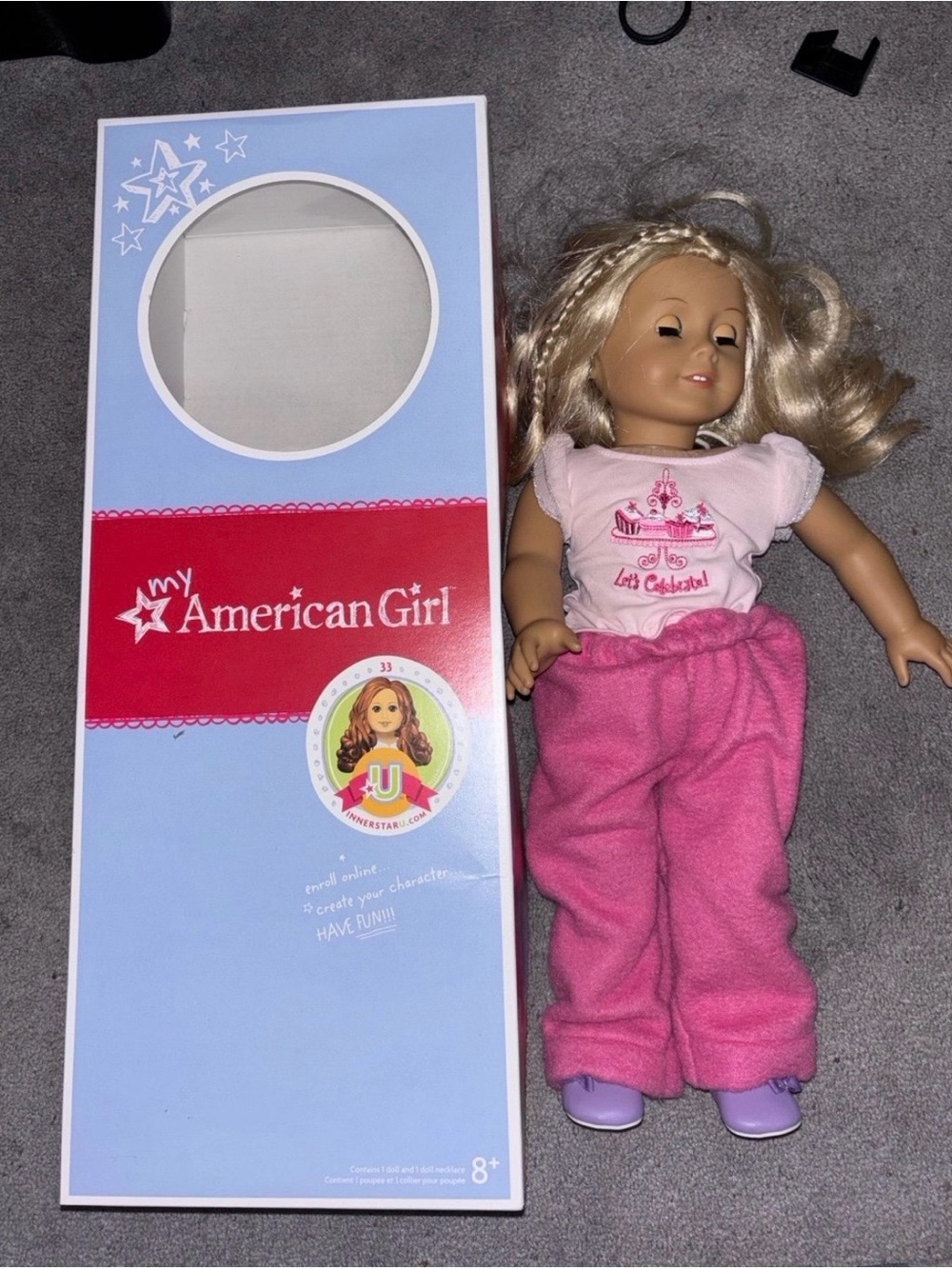 American Girl Doll with Pink Pajamas, "Let's Celebrate" Shirt, and Box.